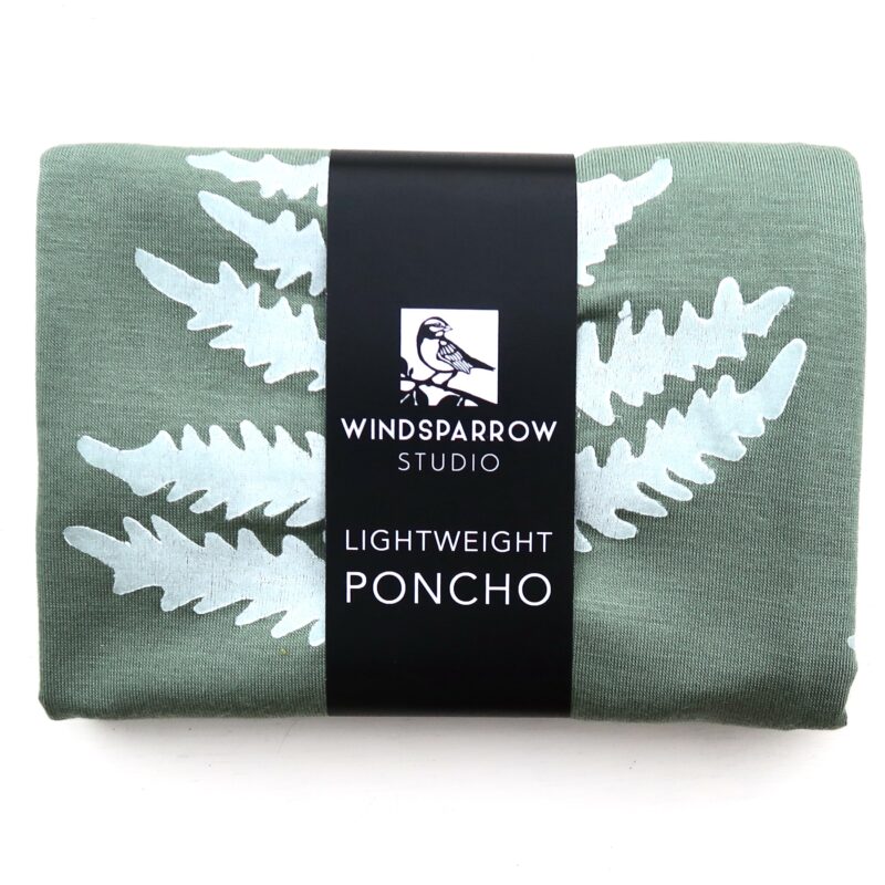 Fern poncho (white ink) in packaging