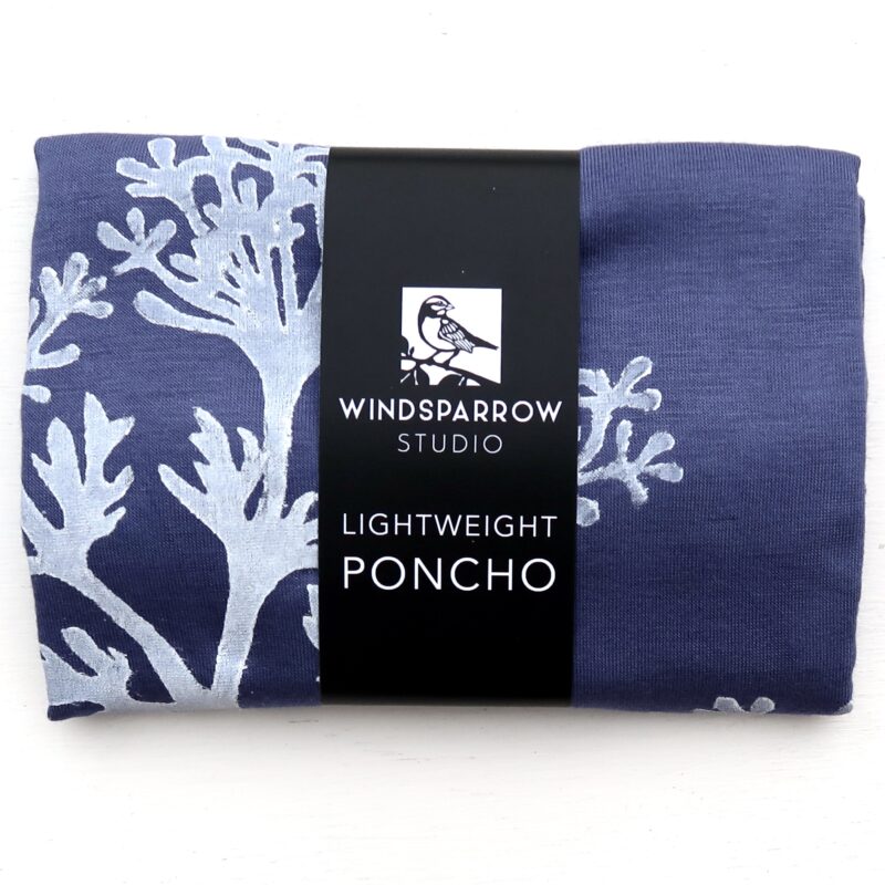 Parsley poncho (white ink) in packaging